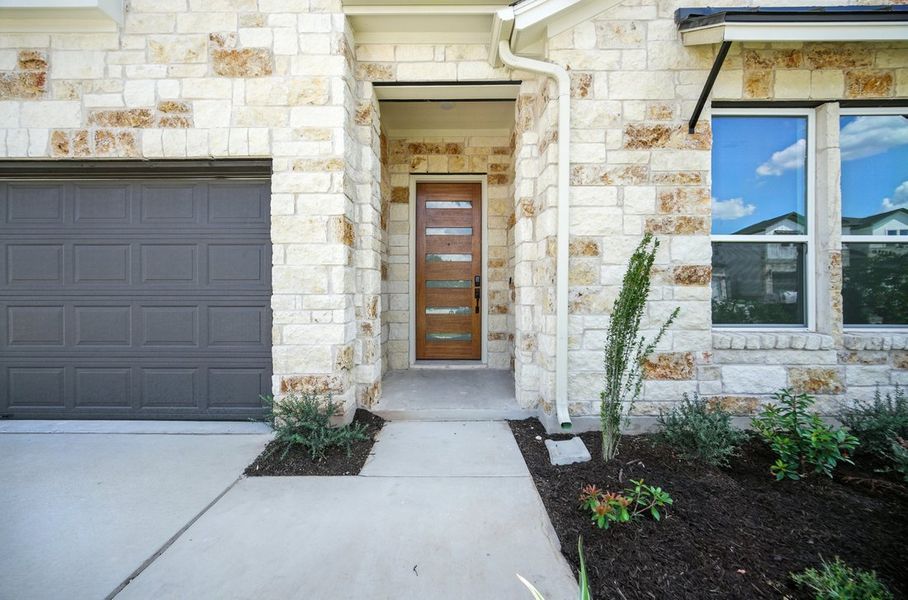 Front exterior of a new home in Foxfield, Austin, TX, highlighting curb appeal (Image 2).