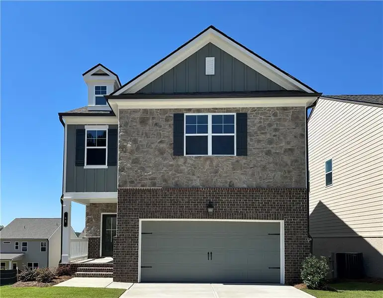 Front exterior of a new home in Kentmere, Auburn, GA, highlighting curb appeal (Image 1). Front exterior of a new home in Kentmere, Auburn, GA, highlighting curb appeal (Image 1).