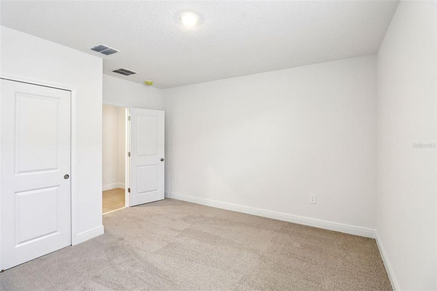 Spacious, unfurnished interior of a new home in The Reserve at Hammock Oaks - Classic Series, Lady Lake (Image 33).
