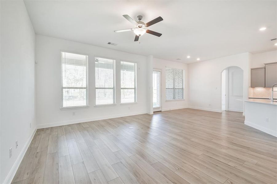 Another view of the Spacious Family Room Featuring Large Windows, Tall Ceilings, and Beautiful natural light throughout