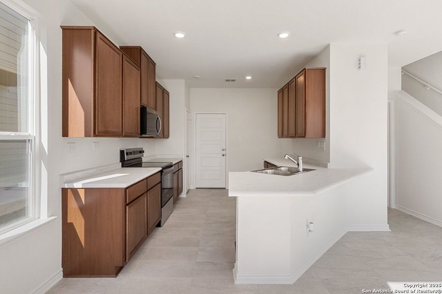 Furnished interior view inside a new home in Spanish Trails Villas, San Antonio (Image 6).
