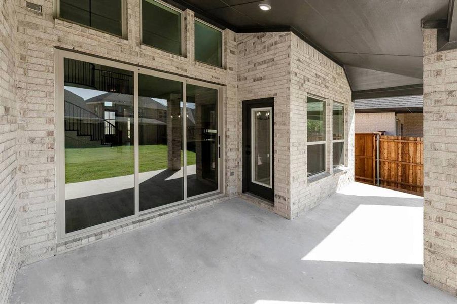 Exterior details and patio area of a home in Valencia on The Lake, Little Elm (Image 3).