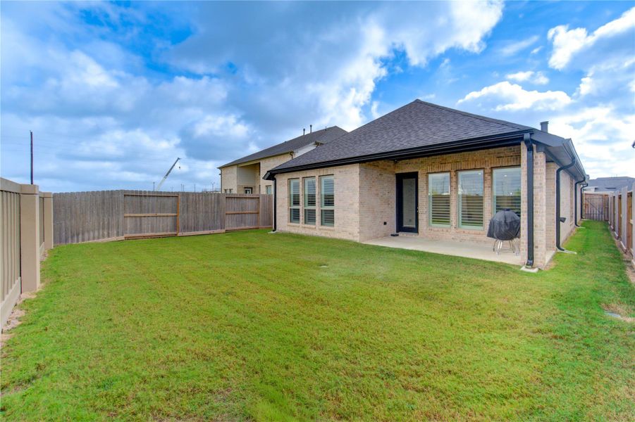 Exterior details and patio area of a home in Cross Creek West 45', Fulshear (Image 2). Exterior details and patio area of a home in Cross Creek West 45', Fulshear (Image 2).