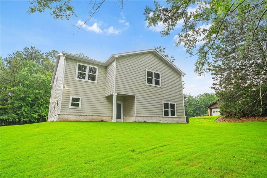 Front exterior of a new home in , Stockbridge, GA, highlighting curb appeal (Image 31).