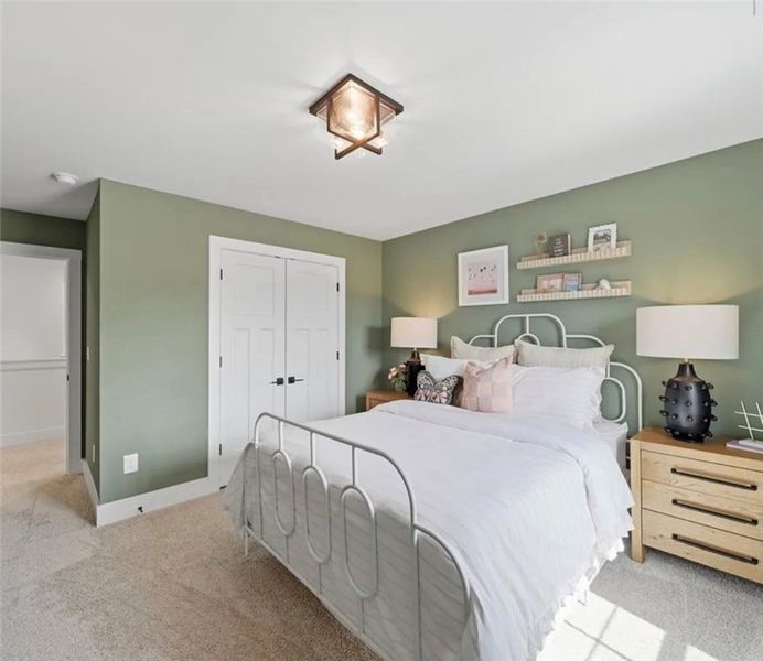 A well-lit bedroom offers soft carpet and a charmi A well-lit bedroom offers soft carpet and a charmi