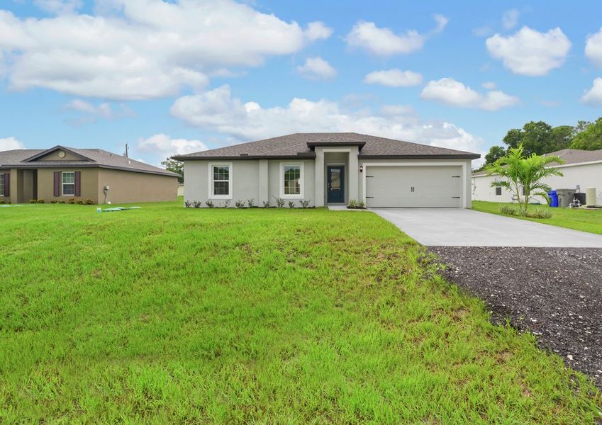 A beautiful house with landscaping and two-car garage. A beautiful house with landscaping and two-car garage.