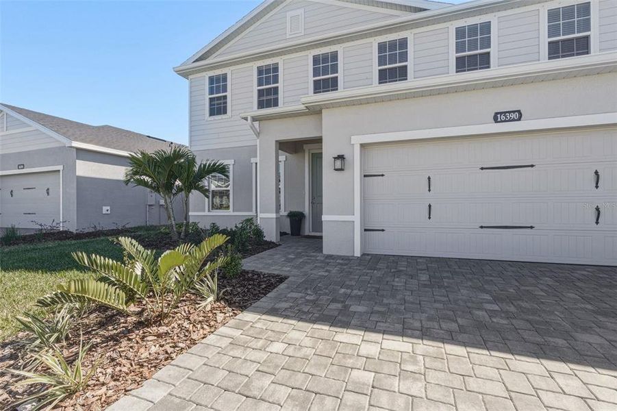 Exterior details and patio area of a home in West Port Single Family Homes, Port Charlotte (Image 2).