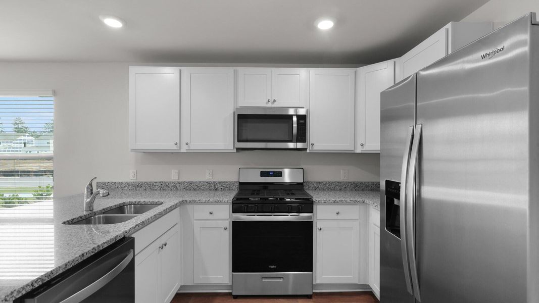 Furnished interior view inside a new home in Pine Hills Townhomes at Cane Bay, Summerville (Image 8).