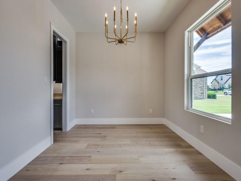Dining Room with access to butlers pantry with custom cabinets and wine rack