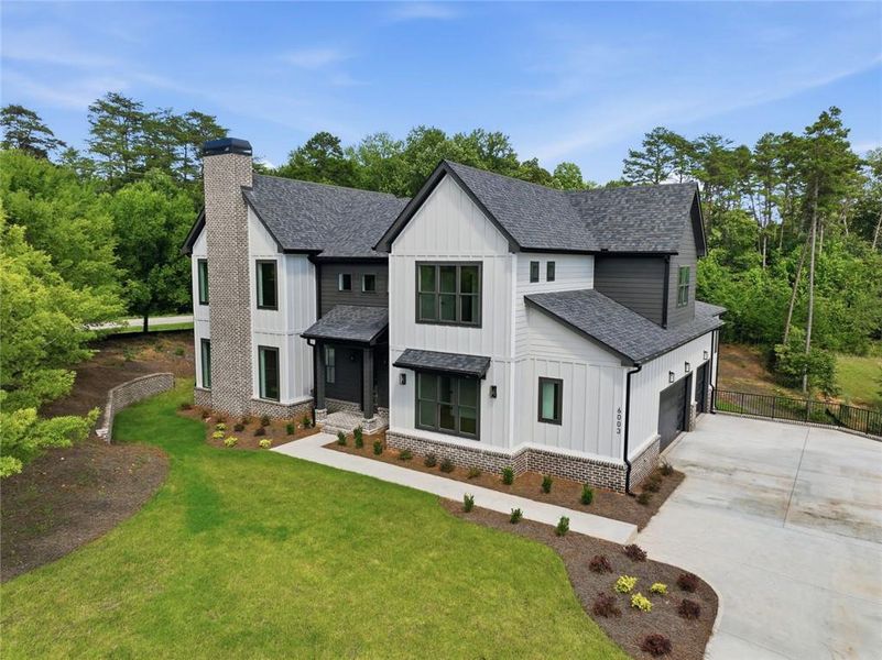 Front exterior of a new home in , Gainesville, GA, highlighting curb appeal (Image 2). Front exterior of a new home in , Gainesville, GA, highlighting curb appeal (Image 2).