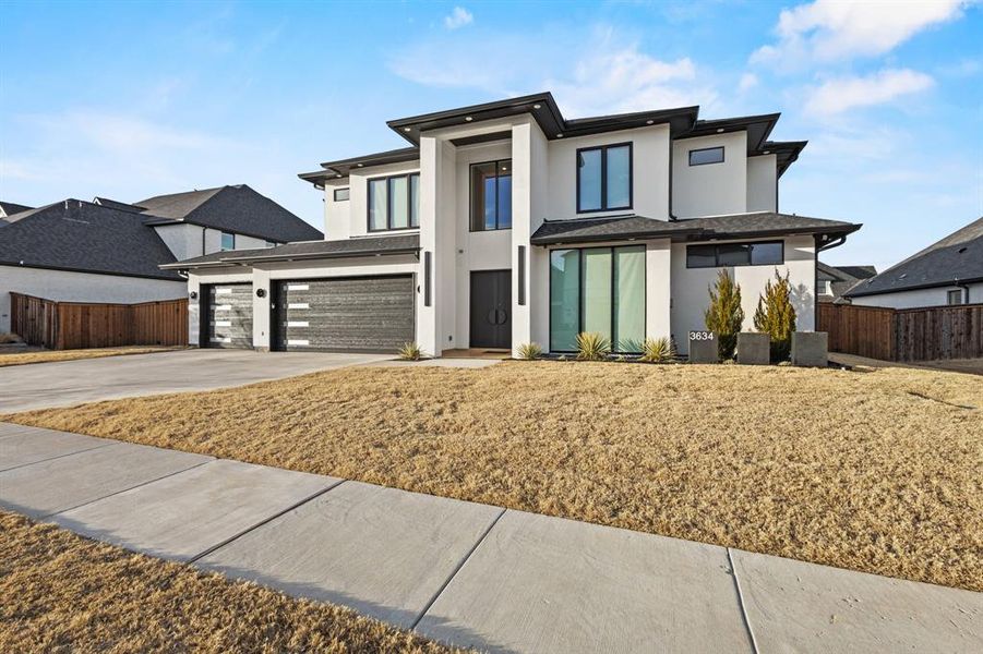 Front exterior of a new home in , Frisco, TX, highlighting curb appeal (Image 23).