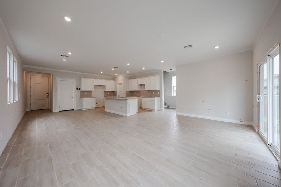 A large empty room with white cabinets. A large empty room with white cabinets.