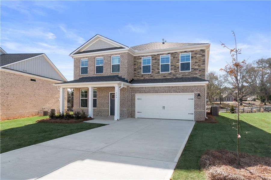 Front exterior of a new home in Kingston, Locust Grove, GA, highlighting curb appeal (Image 20).