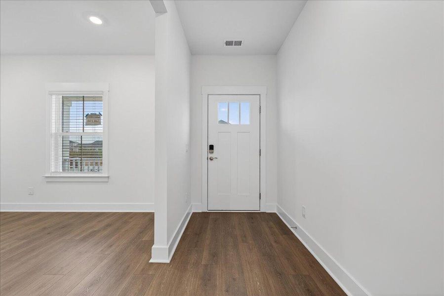 Spacious, unfurnished interior of a new home in The Coves at Lakes of Cane Bay, Summerville (Image 32).
