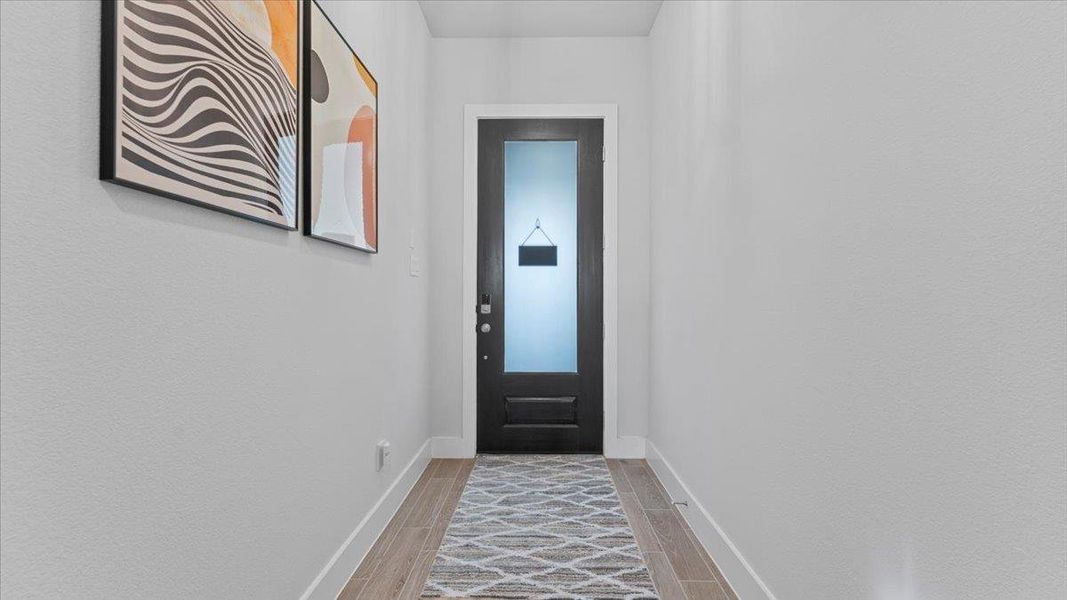 Doorway to outside featuring wood tiled floors Doorway to outside featuring wood tiled floors