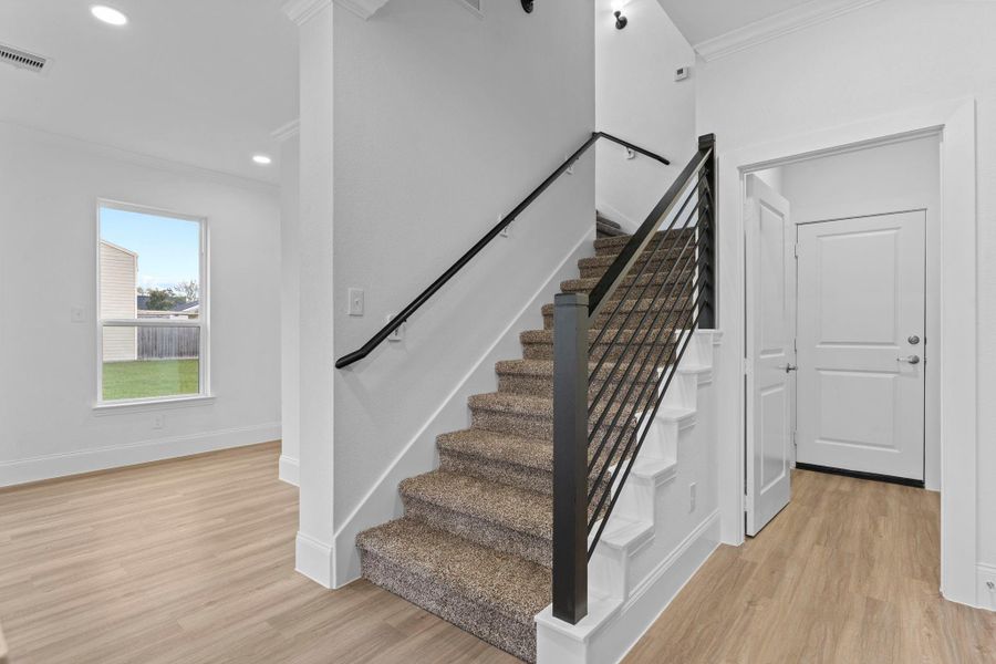 Chic modern iron stairway leading upstairs.