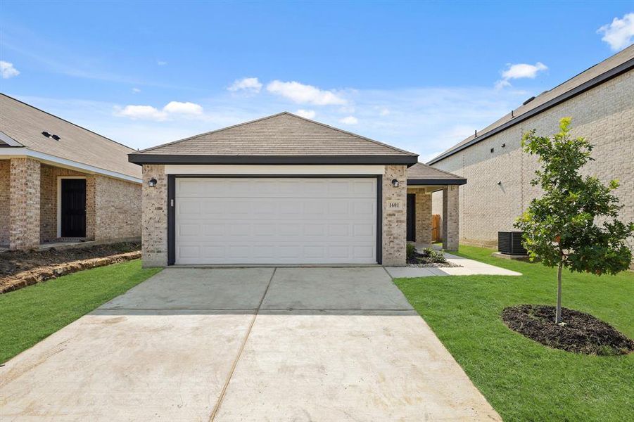 Front exterior of a new home in Christian Meadows, Ennis, TX, highlighting curb appeal (Image 2). Front exterior of a new home in Christian Meadows, Ennis, TX, highlighting curb appeal (Image 2).
