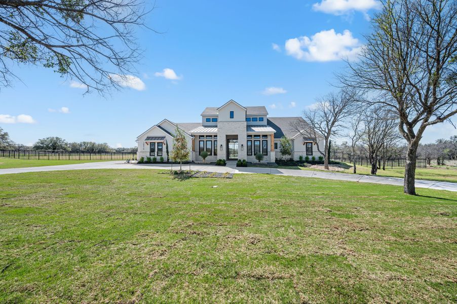 Front exterior of a new home in Fleming Pointe, Fort Worth, TX, highlighting curb appeal (Image 26).