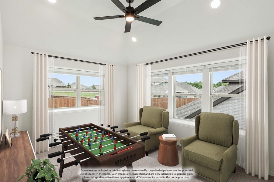 Game room with foosball table, two armchairs, ceiling fan, and large windows with neighborhood views Game room with foosball table, two armchairs, ceiling fan, and large windows with neighborhood views