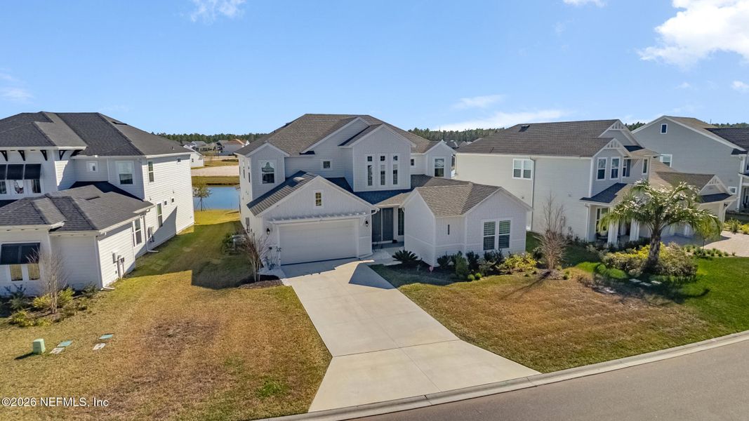 Front exterior of a new home in Middlebourne, St. Johns, FL, highlighting curb appeal (Image 25).