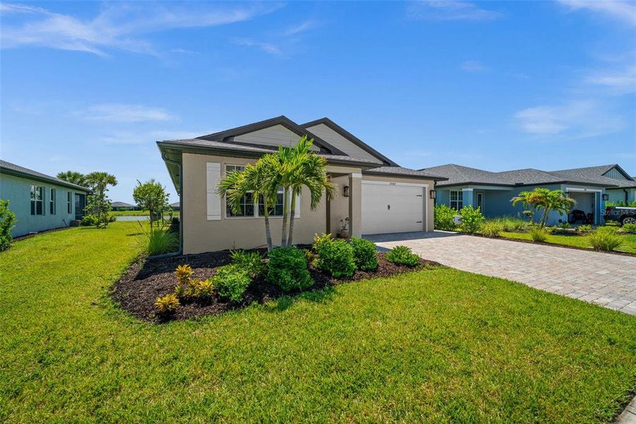 Front exterior of a new home in , Punta Gorda, FL, highlighting curb appeal (Image 2).