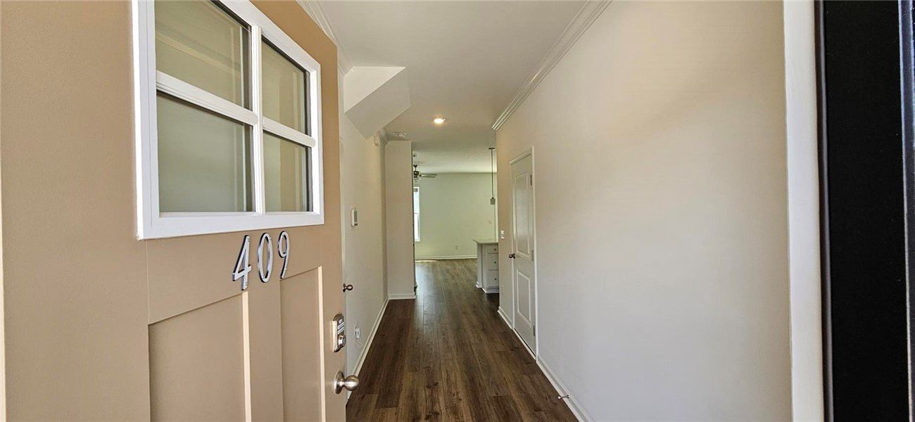 Step into a welcoming entryway boasting stylish fi Step into a welcoming entryway boasting stylish fi