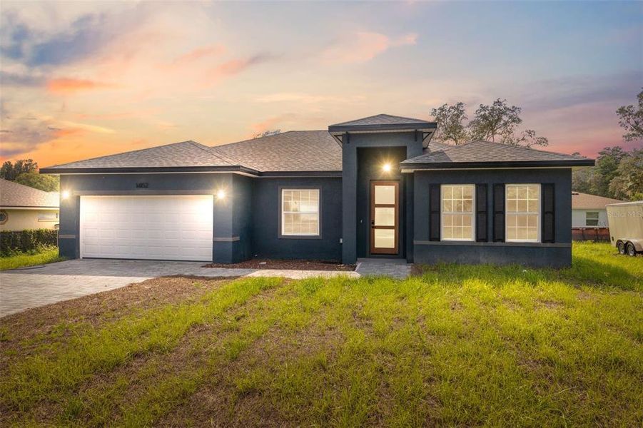 Front exterior of a new home in , Ocala, FL, highlighting curb appeal (Image 14).