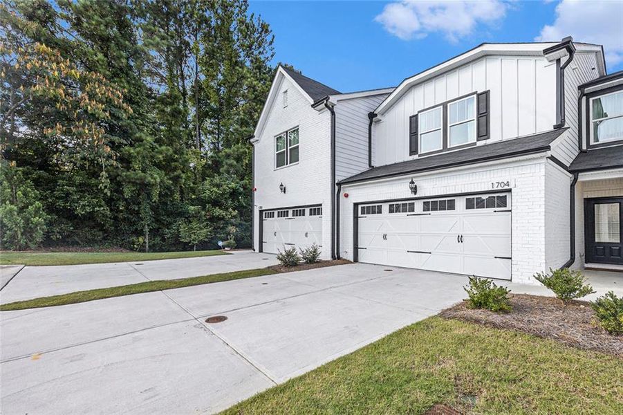 Front exterior of a new home in Terrace at Riverview Landing, Mableton, GA, highlighting curb appeal (Image 18).