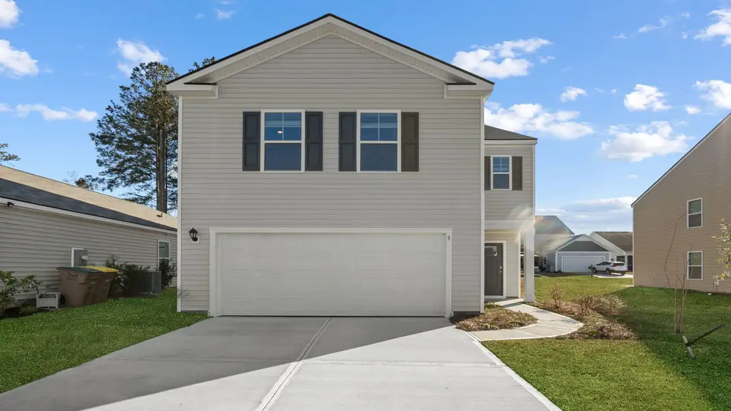 Front exterior of a new home in Rice Hope, Port Wentworth, GA, highlighting curb appeal (Image 1). Front exterior of a new home in Rice Hope, Port Wentworth, GA, highlighting curb appeal (Image 1).