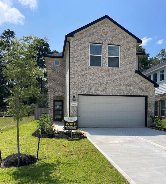 Front exterior of a new home in Enclave at Willis, Willis, TX, highlighting curb appeal (Image 1). Front exterior of a new home in Enclave at Willis, Willis, TX, highlighting curb appeal (Image 1).