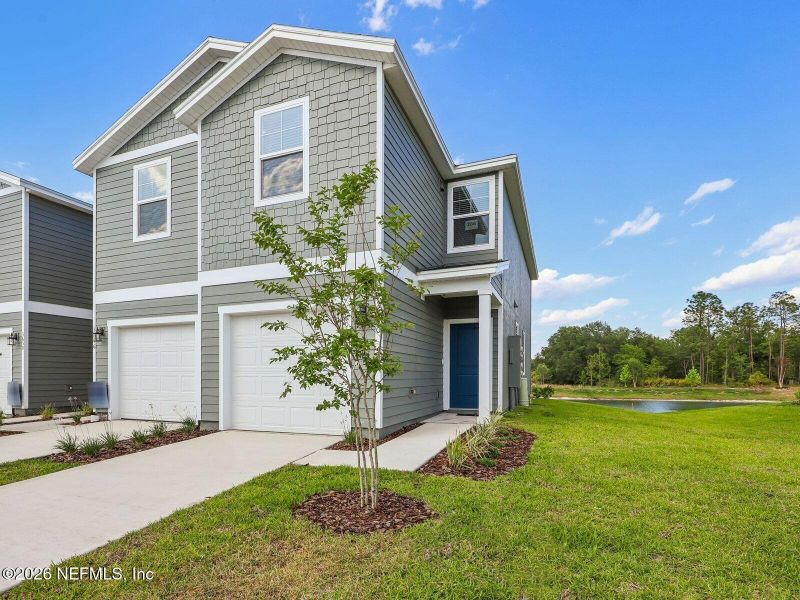 Front exterior of a new home in , Middleburg, FL, highlighting curb appeal (Image 2). Front exterior of a new home in , Middleburg, FL, highlighting curb appeal (Image 2).