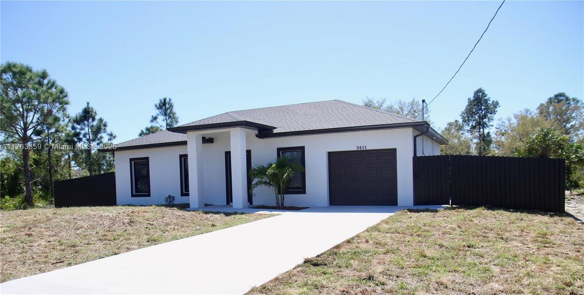 Front exterior of a new home in , Lehigh Acres, FL, highlighting curb appeal (Image 2).