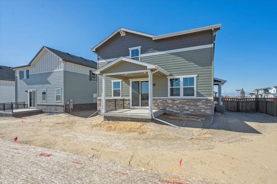 A house with a sandy yard. A house with a sandy yard.