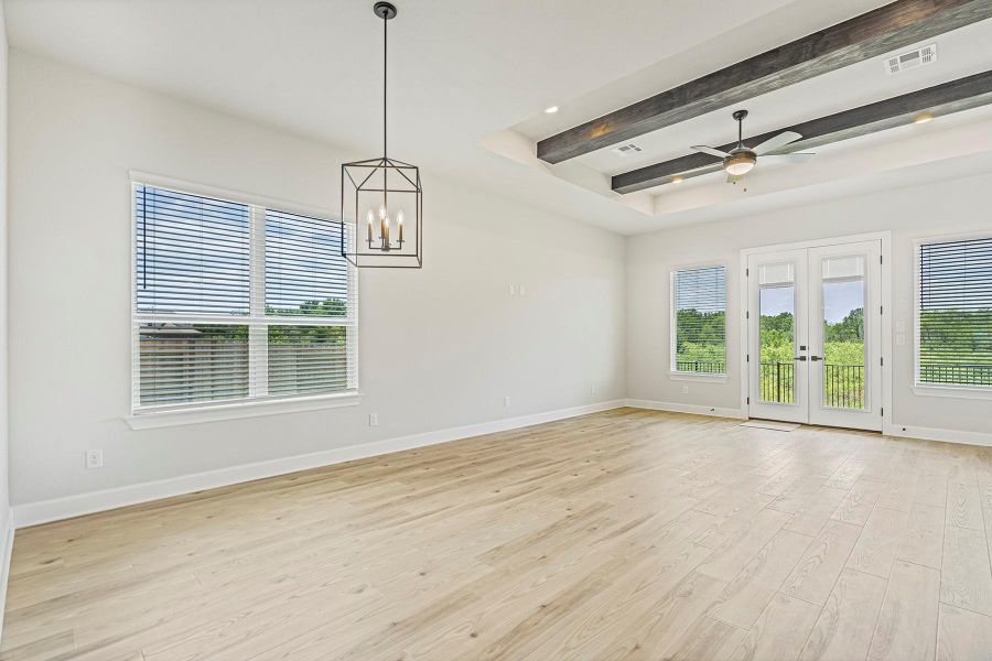 Attached to the family room is the dining area and beautiful kitchen, additional areas where memories can be made while baking your favorite treats or eating dinner as a family Attached to the family room is the dining area and beautiful kitchen, additional areas where memories can be made while baking your favorite treats or eating dinner as a family