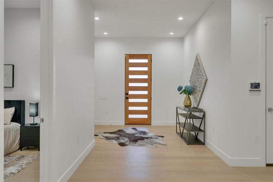 Entrance foyer featuring light wood-style flooring and recessed lighting Entrance foyer featuring light wood-style flooring and recessed lighting