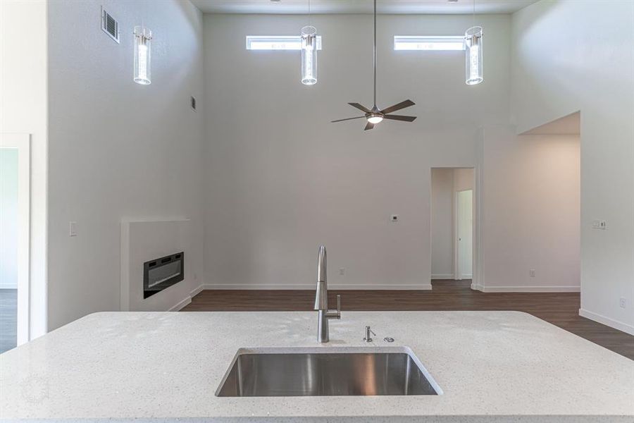 Large kitchen island/bar looking out into living room