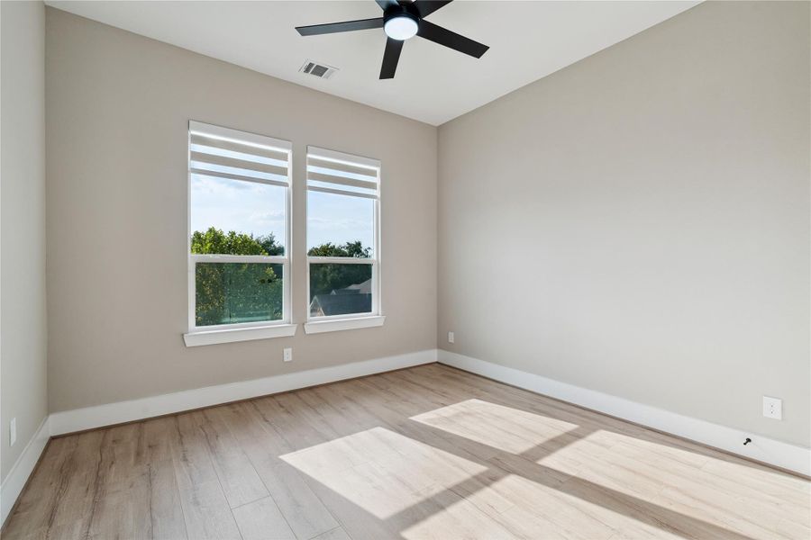 Proportioned and light-filled, this secondary bedroom reflects balance and spatial clarity.