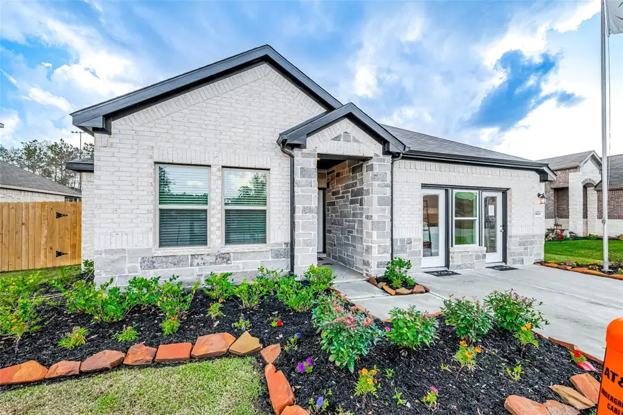Front exterior of a new home in Splendora Fields, Splendora, TX, highlighting curb appeal (Image 2).