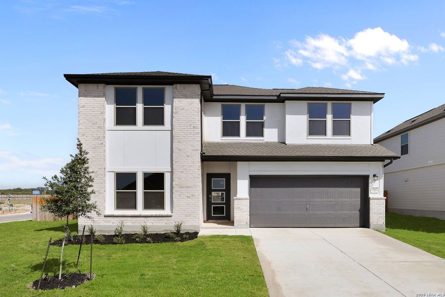 Front exterior of a new home in Summerlin, San Antonio, TX, highlighting curb appeal (Image 24).