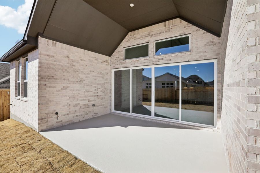Exterior details and patio area of a home in Sunfield, Buda (Image 19).