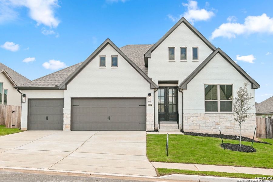 Front exterior of a new home in Ventana - 70', Bulverde, TX, highlighting curb appeal (Image 14).