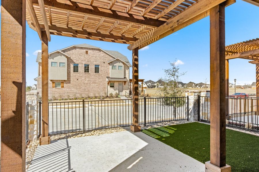 Exterior details and patio area of a home in The Tribute, The Colony (Image 26).
