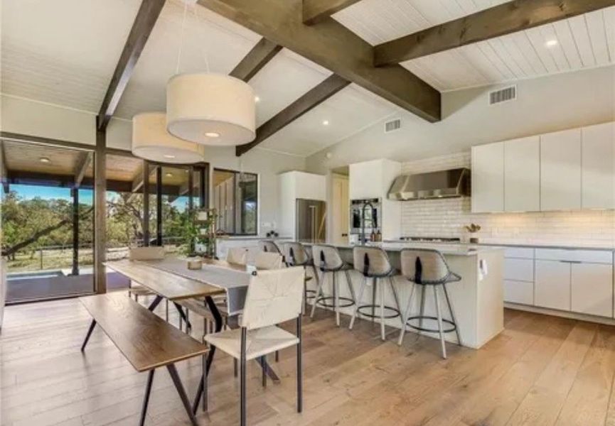 Dining space featuring light wood-style floors and recessed lighting Dining space featuring light wood-style floors and recessed lighting