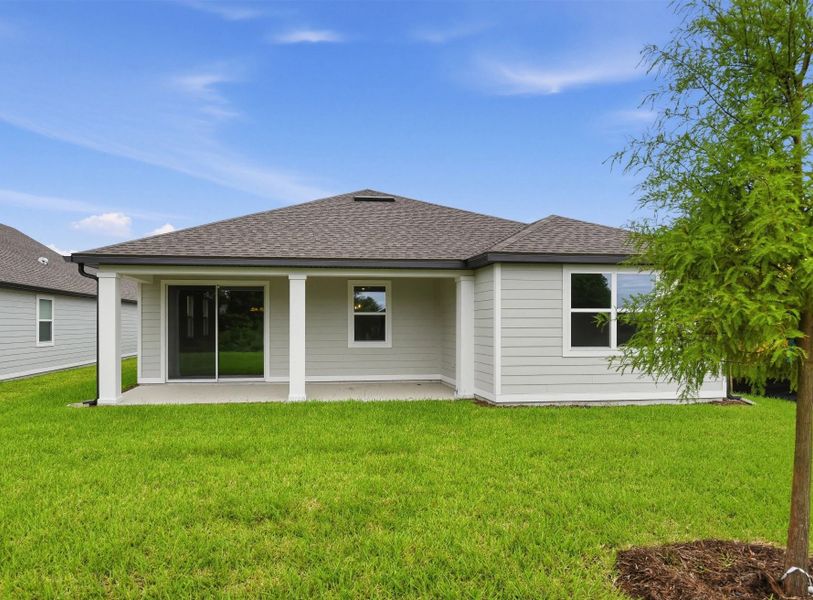 Exterior details and patio area of a home in Ardisia Park, New Smyrna Beach (Image 3).
