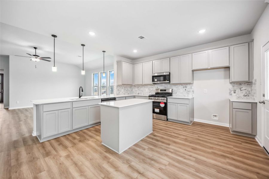 Chef-inspired kitchen featuring a LARGE ISLAND, modern finishes, and plenty of cabinet space!