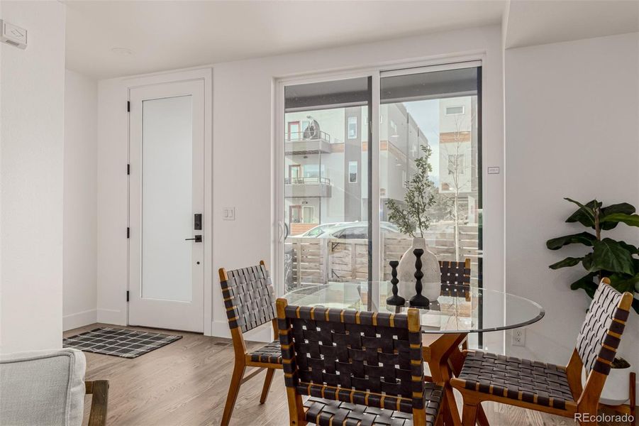 Dining room opens onto covered front porch and yard
