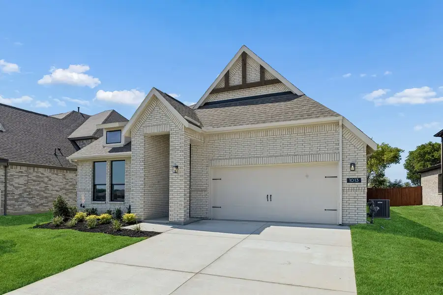 Front exterior of a new home in Parkmont – Timberbrook, Justin, TX, highlighting curb appeal (Image 2). Front exterior of a new home in Parkmont – Timberbrook, Justin, TX, highlighting curb appeal (Image 2).