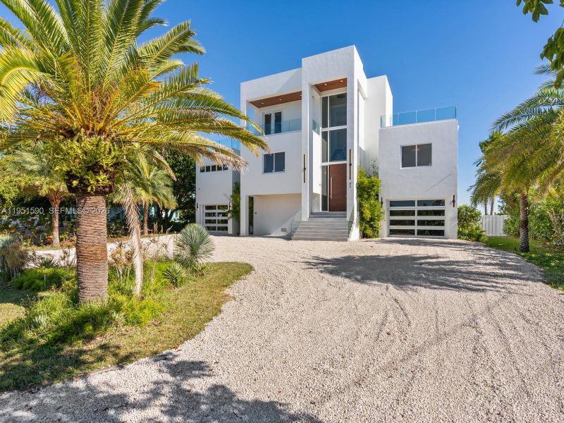 Front exterior of a new home in , Marathon, FL, highlighting curb appeal (Image 26).