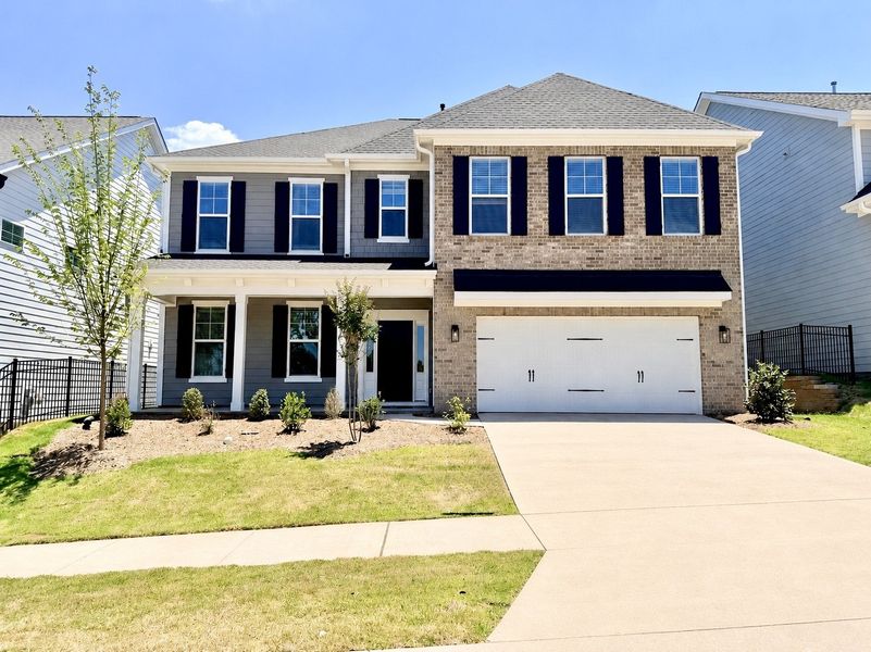 Front exterior of a new home in Sweetbrier, Durham, NC, highlighting curb appeal (Image 1). Front exterior of a new home in Sweetbrier, Durham, NC, highlighting curb appeal (Image 1).
