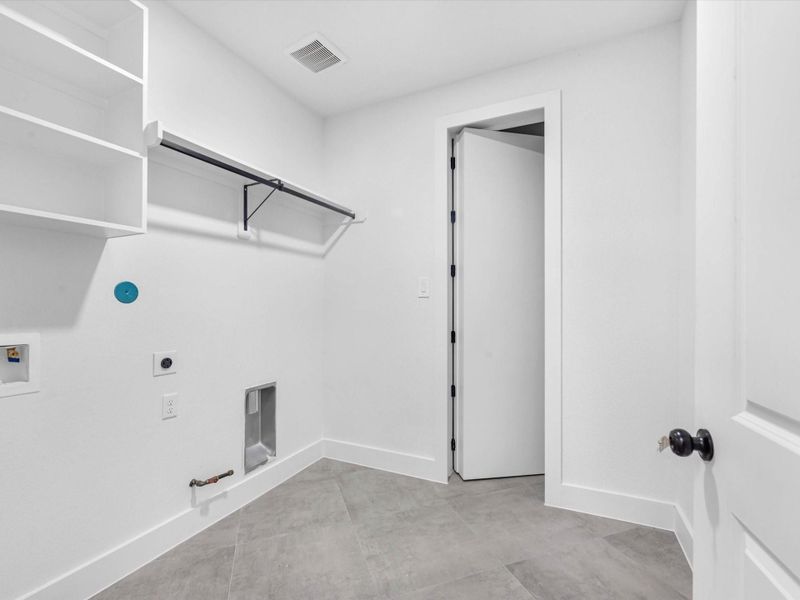 Laundry room has easy access to the primary closet making laundry day a breeze! There are also gas connections for your convivence.